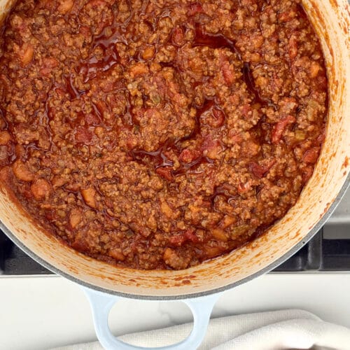 cooking bolognese meat sauce in Dutch oven