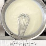 Béchamel sauce in a saucepan used for lasagna and baked pasta dishes.