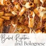 Close-up of baked rigatoni with Bolognese and melted cheese in a baking dish with a wooden spoon