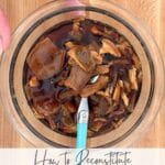 Dried porcini mushrooms soaking in water and softening for cooking