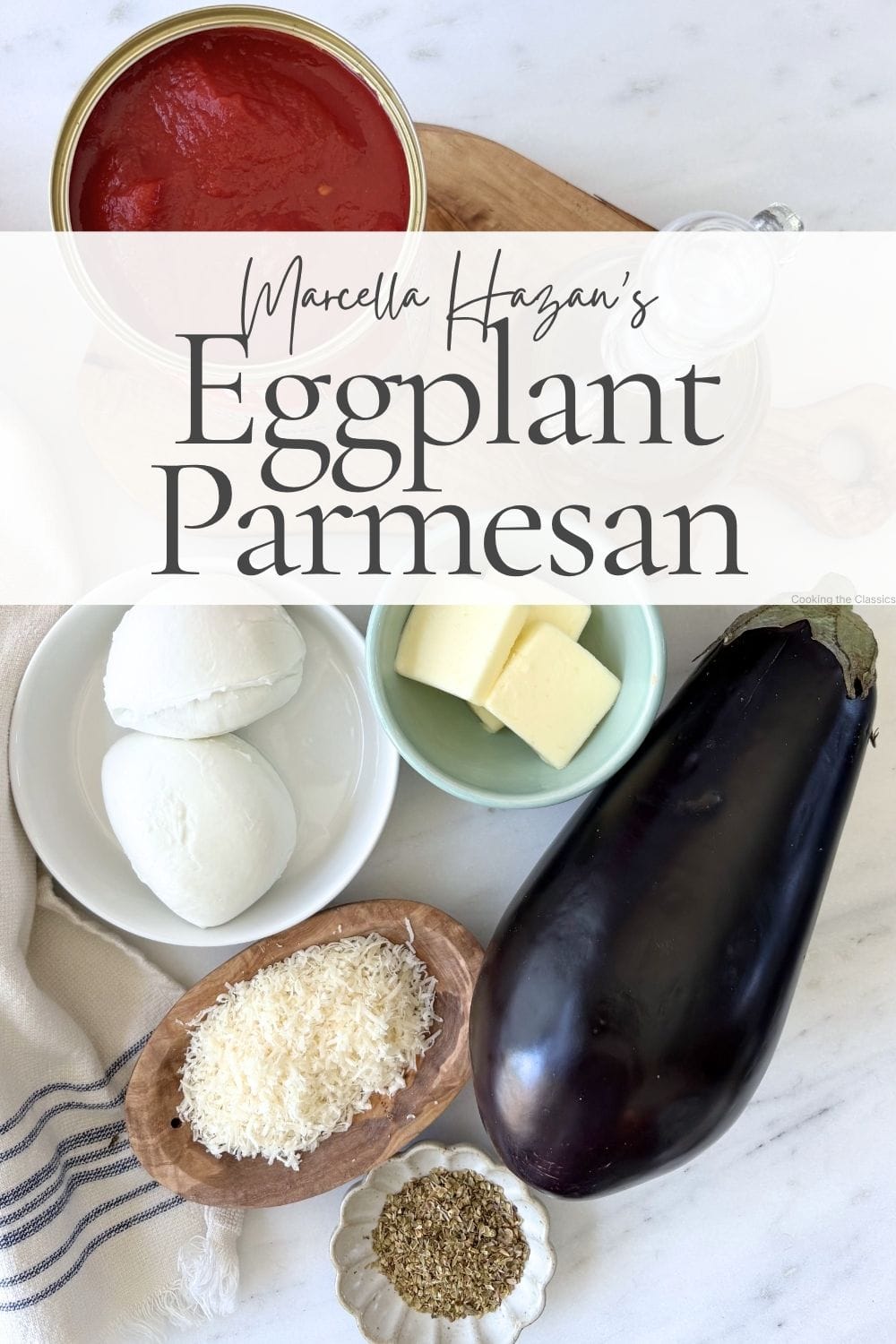 Ingredients for Marcella Hazan’s Eggplant Parmesan including eggplant, canned tomatoes, buffalo mozzarella, parmesan, butter, and oregano.