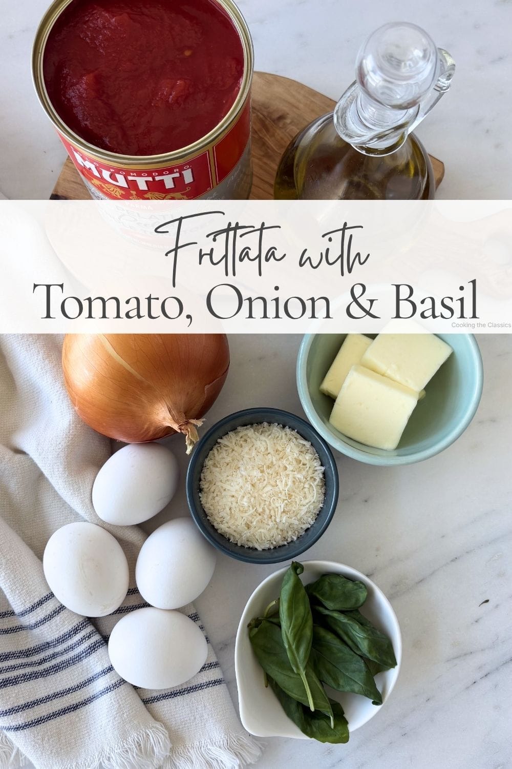 Ingredients for tomato, onion, and basil frittata arranged on a marble countertop, including canned tomatoes, olive oil, onion, eggs, fresh basil, butter, and grated Parmigiano-Reggiano, with the recipe title overlaid.