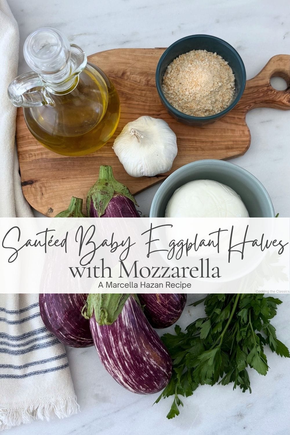 Baby eggplants with mozzarella, garlic, breadcrumbs, olive oil, and parsley arranged on a marble counter for sautéed eggplant with mozzarella.