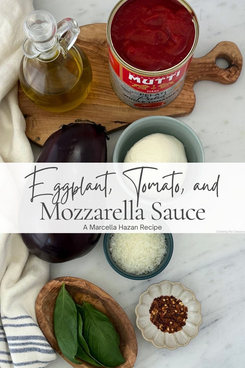 Eggplant, canned whole tomatoes, olive oil, fresh mozzarella, Pecorino Romano, basil, and red chili flakes arranged for eggplant and tomato pasta sauce.