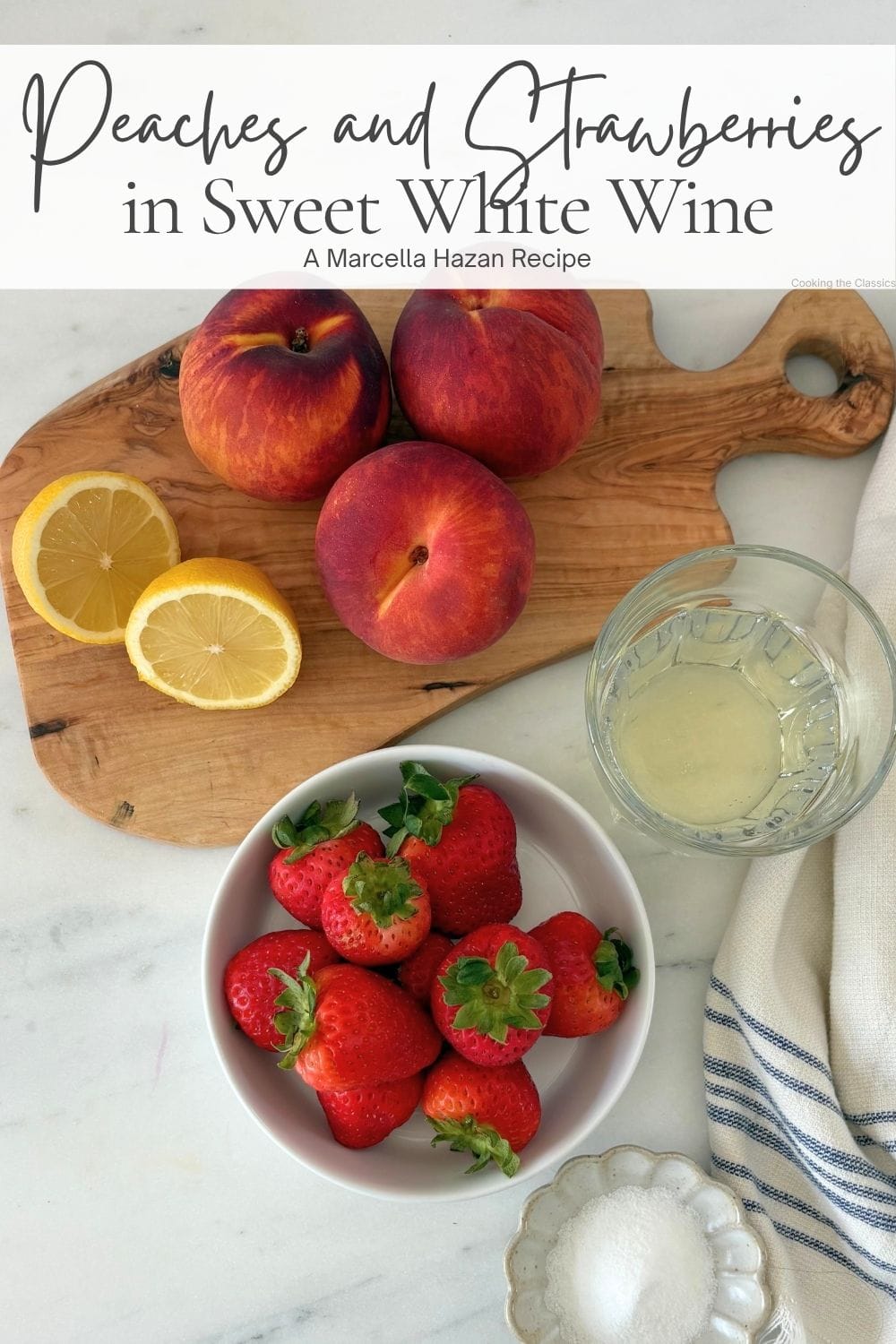 Peaches, strawberries, lemon, sugar, and sweet white wine arranged for making peaches and strawberries in sweet white wine.