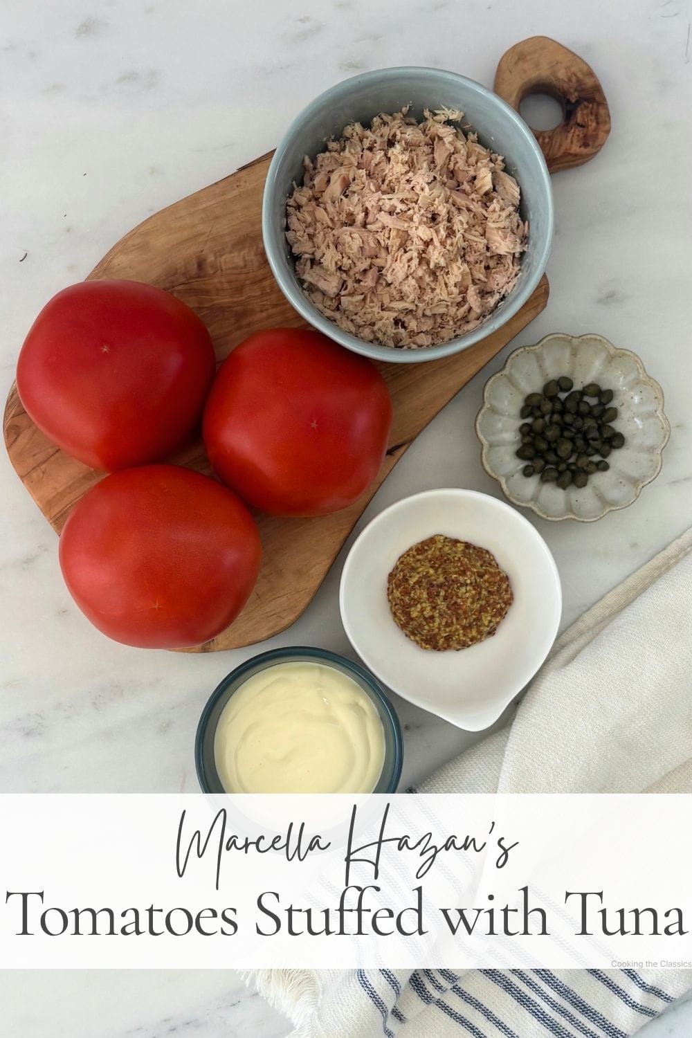 Tomatoes, tuna, capers, whole-grain mustard, and homemade mayonnaise arranged for making tuna-stuffed tomatoes.